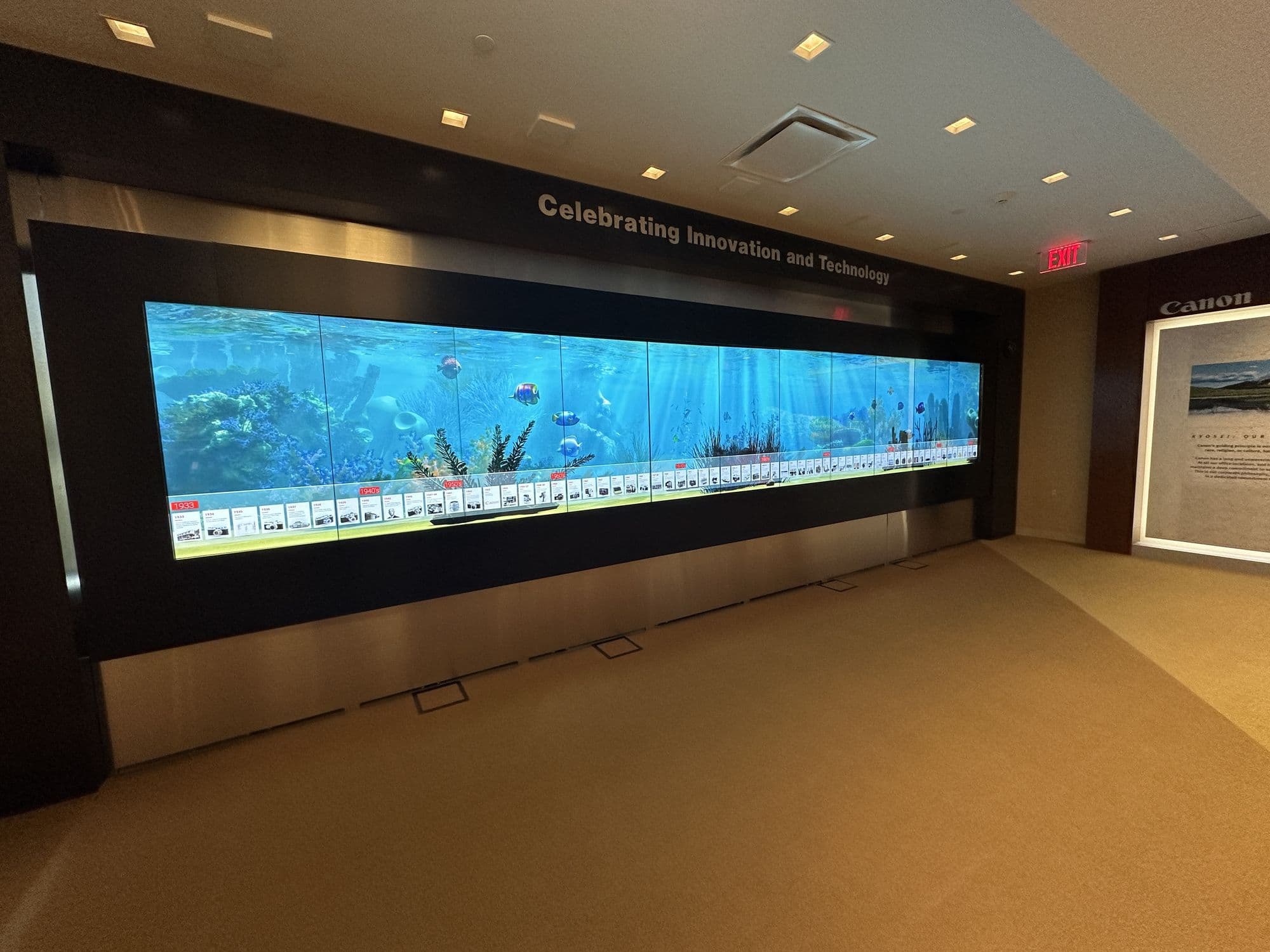 The 25-foot interactive History of Canon wall in a corporate lobby