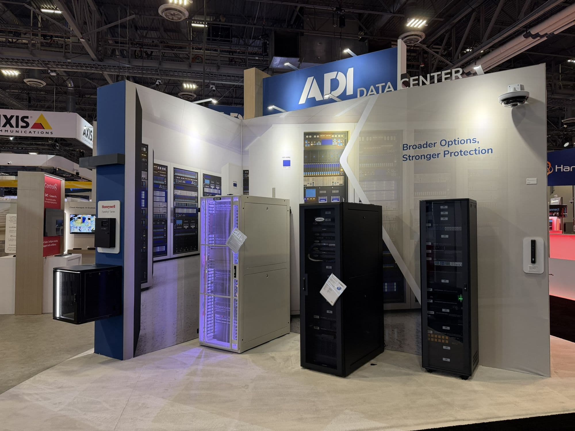 A data center demonstration zone with server racks in a trade show booth