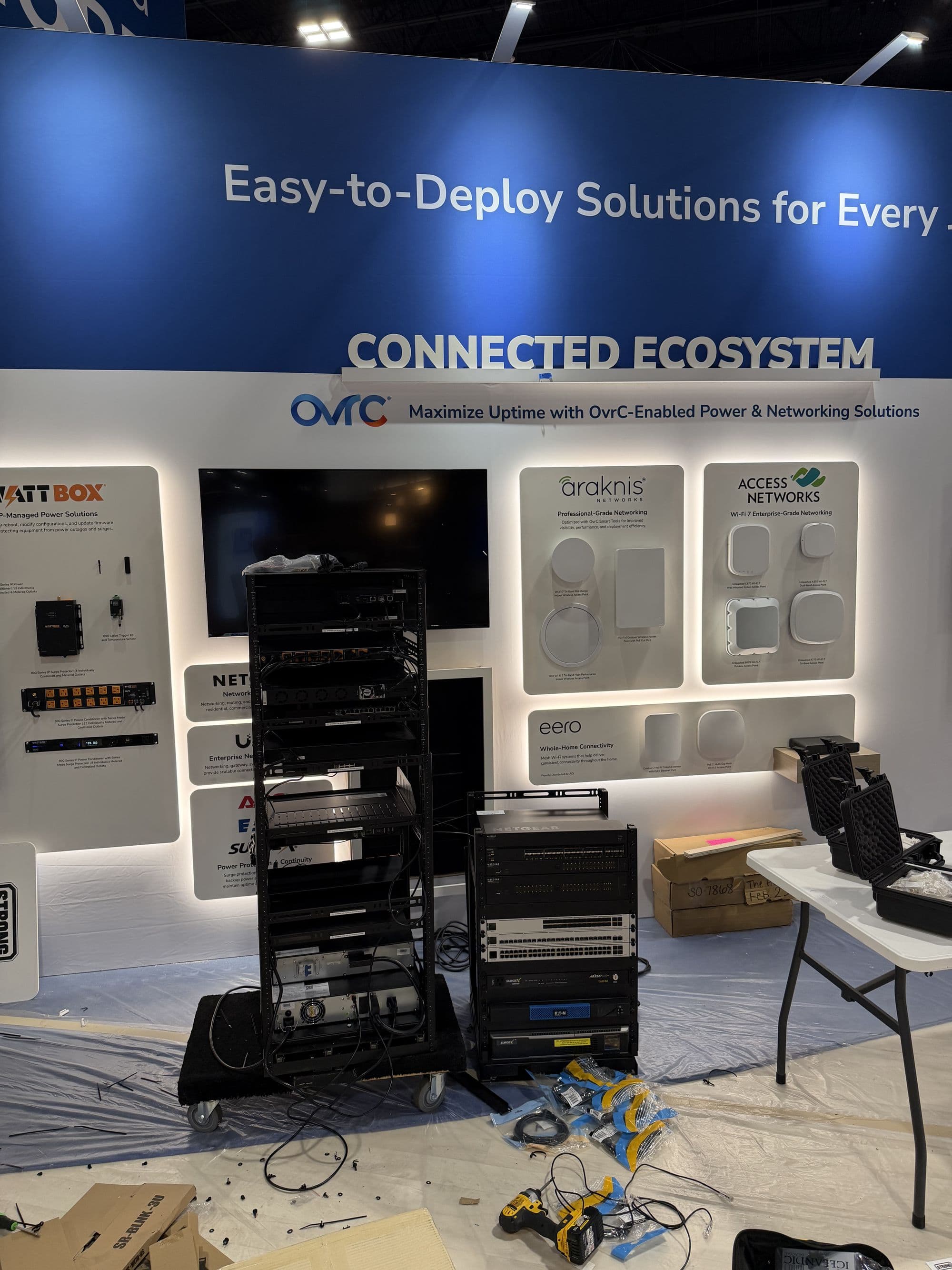 An equipment rack being cabled in a booth before the show opens